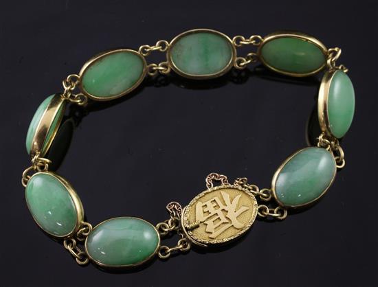 A Chinese gold and cabochon jadeite bracelet, 6.5in.